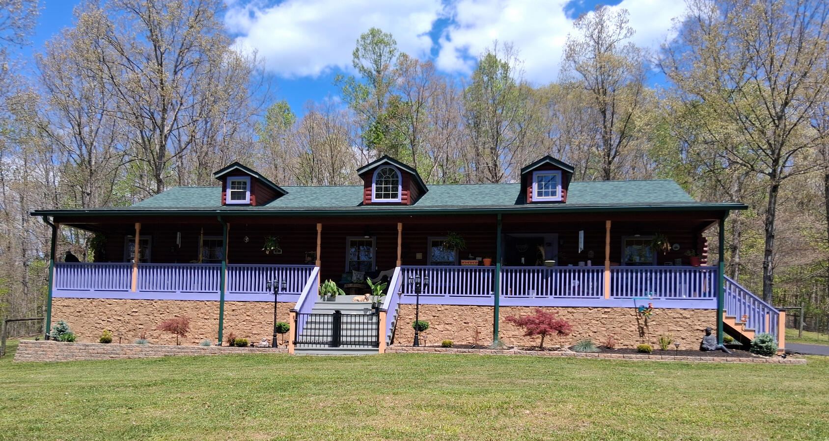 fairdale home landscape renovation log cabin home with premium landscaping with low retaining wall and designer plants with multi texture in greater beckley wv